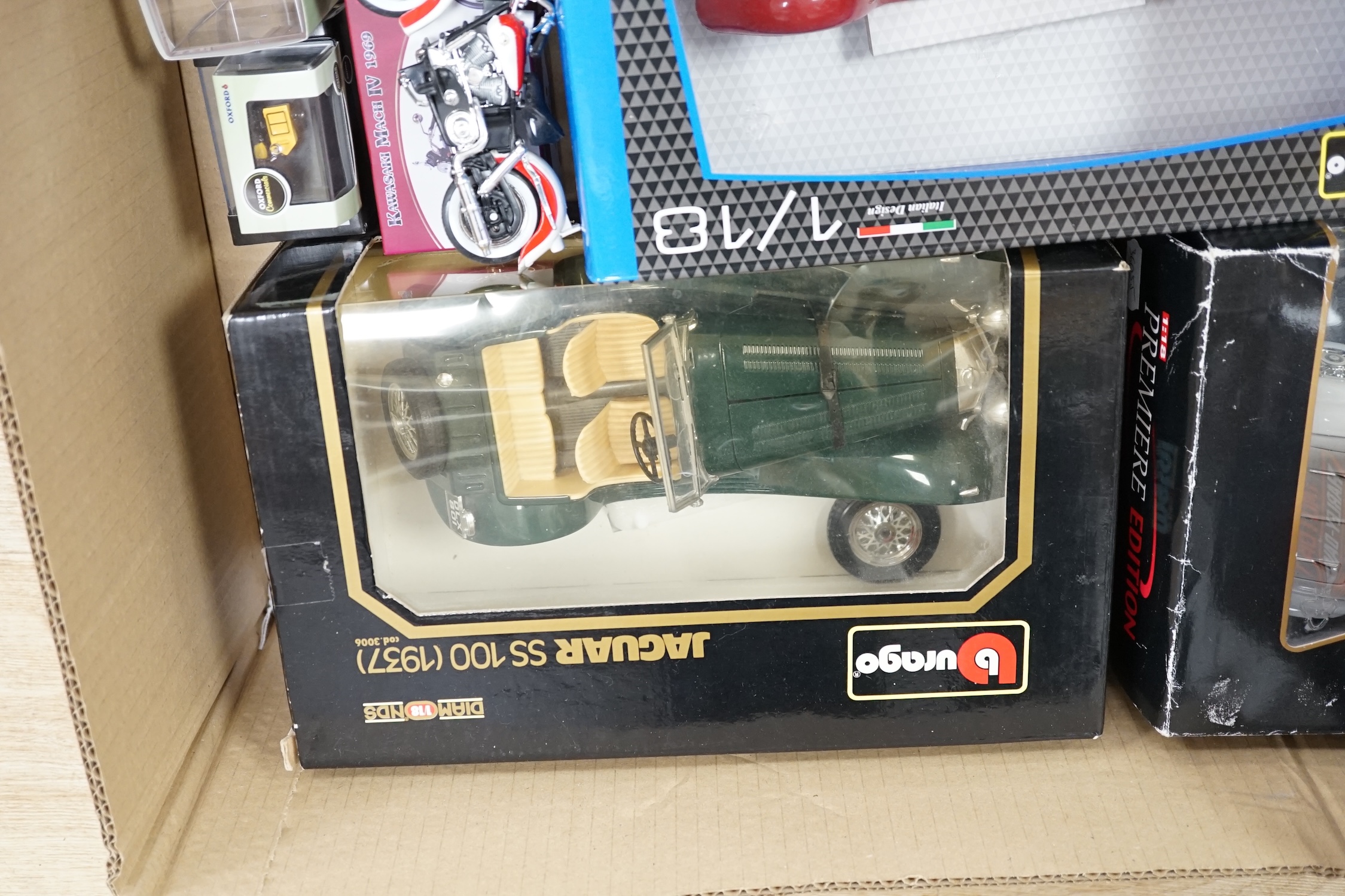 A quantity of diecast vehicles, including Burago, Harley Davidson, Maisto, etc. Condition - varies